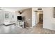 Bright open concept room featuring a tiled floor and neutral decor at 9214 N 54Th Ave, Glendale, AZ 85302