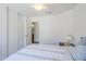 Bright bedroom featuring a bed, soft lighting, and a sliding door closet, offering ample storage at 941 E Desert Moon Trl, San Tan Valley, AZ 85143
