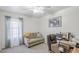 Bright bedroom with a sofa, desk, and a large window providing plenty of natural light at 941 E Desert Moon Trl, San Tan Valley, AZ 85143
