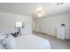 Spacious bedroom with a fitness machine, dressers, and plenty of natural light creating a versatile living space at 941 E Desert Moon Trl, San Tan Valley, AZ 85143