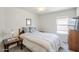 Comfortable bedroom with a wooden frame bed, side tables, and soft lighting, creating a cozy ambiance at 941 E Desert Moon Trl, San Tan Valley, AZ 85143