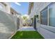 Backyard featuring desert landscaping with artificial turf at 1005 N Granite Reef Rd, Scottsdale, AZ 85257