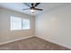 Neutral bedroom with window and ceiling fan at 1005 N Granite Reef Rd, Scottsdale, AZ 85257