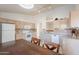 Kitchen with tile floors, dining table, and white appliances at 10305 E Dragoon Ave, Mesa, AZ 85208