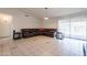 Living room with a leather sectional and tile floors at 10305 E Dragoon Ave, Mesa, AZ 85208