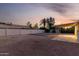 Large backyard space with gravel landscaping and a covered patio area at 1055 E Ingram St, Mesa, AZ 85203