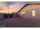 Backyard area with fenced enclosure, low maintenance landscape, and desert style exterior at 1055 E Ingram St, Mesa, AZ 85203