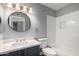Bathroom with modern sink, updated vanity, stylish mirror and tub-shower combo at 1055 E Ingram St, Mesa, AZ 85203