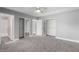 Spacious bedroom features multiple closets, neutral color palette and comfortable carpet at 1055 E Ingram St, Mesa, AZ 85203