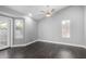 Bright bedroom with a vaulted ceiling, fan, and dark wood-look flooring at 1055 E Ingram St, Mesa, AZ 85203
