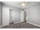 Bedroom with closet, neutral color palette, and comfortable carpet at 1055 E Ingram St, Mesa, AZ 85203