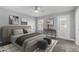 Well-lit bedroom features soft, neutral tones, ceiling fan, and walkout access at 1055 E Ingram St, Mesa, AZ 85203