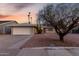 Charming single-story home featuring desert landscaping and a two-car garage on a spacious lot at 1055 E Ingram St, Mesa, AZ 85203