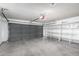 Spacious garage featuring ample storage shelving and an automatic door at 1055 E Ingram St, Mesa, AZ 85203