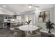 Bright open-concept kitchen and dining area with stainless steel appliances and a marble table at 1055 E Ingram St, Mesa, AZ 85203