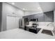 Modern kitchen with granite countertops, stainless steel appliances, and a center island sink at 1055 E Ingram St, Mesa, AZ 85203