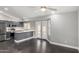 Bright open-concept kitchen with stainless steel appliances, a breakfast bar, and french doors at 1055 E Ingram St, Mesa, AZ 85203