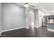 Spacious living room with sleek flooring open to kitchen with stainless appliances at 1055 E Ingram St, Mesa, AZ 85203
