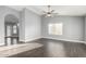 Open living area with stylish gray walls, sleek flooring, and arched doorway at 1055 E Ingram St, Mesa, AZ 85203