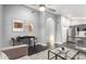Cozy open-concept living area with kitchen access, modern furniture, and stylish decor at 1055 E Ingram St, Mesa, AZ 85203
