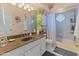 Bright bathroom featuring decorative light fixtures, fresh plants and ample counter space at 14420 N 44Th Dr, Glendale, AZ 85306