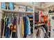 Organized closet with hanging clothes, shelves for storage, and shoe organizers maximizing storage at 14420 N 44Th Dr, Glendale, AZ 85306