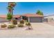Charming single-story home with well-maintained landscaping, a desert front yard, and an inviting curb appeal at 14420 N 44Th Dr, Glendale, AZ 85306