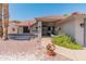 Charming front entrance with desert landscaping, colorful flowers, and a well-maintained walkway to the front door at 14420 N 44Th Dr, Glendale, AZ 85306