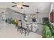 Spacious living room with tile floors, a brick fireplace, and seamless access to the outdoor pool area at 14420 N 44Th Dr, Glendale, AZ 85306