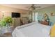 Bright main bedroom featuring a ceiling fan, natural light, and calming decor at 14420 N 44Th Dr, Glendale, AZ 85306