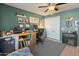 Well-appointed office space featuring a custom desk, stylish décor, and a cozy fireplace at 14420 N 44Th Dr, Glendale, AZ 85306