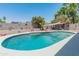 Refreshing backyard pool with well-kept landscaping, providing a relaxing escape and a great spot for summer fun at 14420 N 44Th Dr, Glendale, AZ 85306