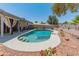 Inviting backyard pool area with shaded patio, lush landscaping, and ample space for outdoor relaxation and entertainment at 14420 N 44Th Dr, Glendale, AZ 85306