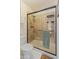 Bathroom with a glass-enclosed shower featuring neutral tones and modern fixtures at 14420 N 44Th Dr, Glendale, AZ 85306