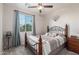 Comfortable bedroom with natural light, ceiling fan, and carpet at 17866 W Lilac St, Goodyear, AZ 85338