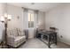 Home office featuring a desk and chair, a plush reading chair and neutral carpeting at 17866 W Lilac St, Goodyear, AZ 85338