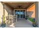Spacious covered patio with ceiling fan, perfect for outdoor dining and entertaining with view of the pool at 17866 W Lilac St, Goodyear, AZ 85338