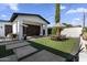 Relaxing backyard space with artificial grass, patio and outdoor dining area at 1807 E Campbell Ave, Phoenix, AZ 85016
