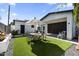 Backyard features a dining area with patio umbrella and artificial turf at 1807 E Campbell Ave, Phoenix, AZ 85016