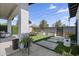 Inviting backyard featuring a cozy seating area, dining space, and lush greenery at 1807 E Campbell Ave, Phoenix, AZ 85016