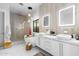 Modern bathroom features dual sinks, a soaking tub, and a separate glass enclosed shower at 1807 E Campbell Ave, Phoenix, AZ 85016