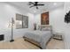 Neutral bedroom with ceiling fan, light wood floors, and art at 1807 E Campbell Ave, Phoenix, AZ 85016