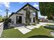 Stunning two-story modern home featuring an artifical lawn, tasteful vegetation and a beautifully designed front walkway at 1807 E Campbell Ave, Phoenix, AZ 85016