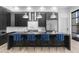 Modern kitchen featuring a large island with counter seating, stainless steel appliances, and sleek cabinetry at 1807 E Campbell Ave, Phoenix, AZ 85016