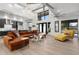 Spacious open-concept living room with modern decor, clerestory windows, and hardwood floors at 1807 E Campbell Ave, Phoenix, AZ 85016