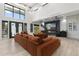 Open-concept living room with a large sectional sofa, fireplace, and clerestory windows at 1807 E Campbell Ave, Phoenix, AZ 85016