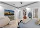 Spacious main bedroom features a walk-in closet, large flatscreen TV, and ensuite bathroom access at 1807 E Campbell Ave, Phoenix, AZ 85016