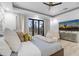 Luxurious main bedroom features a ceiling fan and sliding glass doors to the landscaped backyard at 1807 E Campbell Ave, Phoenix, AZ 85016