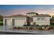 Charming single-Gathering home showcases a three-car garage and desert landscaping at 18860 E Braeburn Ln, Queen Creek, AZ 85142