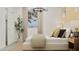 Bright bedroom featuring a large window, modern lighting and neutral decor at 20925 S 231St Way, Queen Creek, AZ 85142